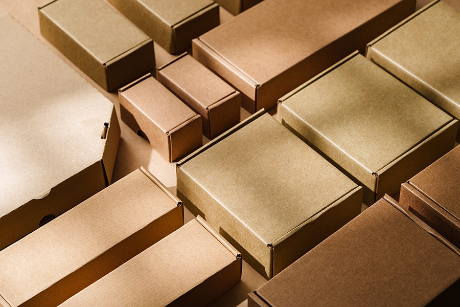 multiple cardboard boxes arranged surface packaging shipping warehouse setting
