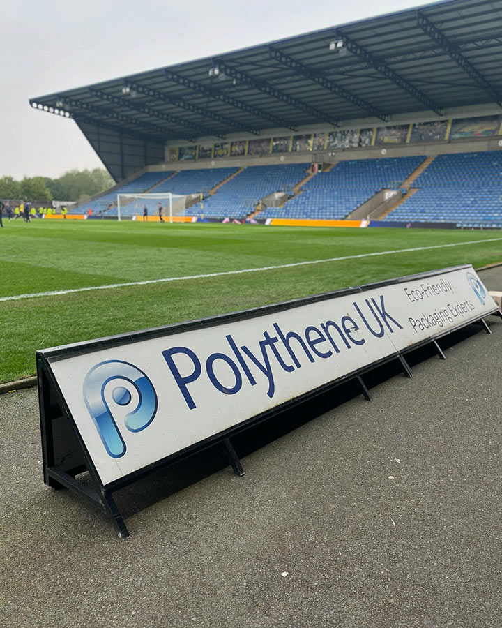 Advertising boards at the Kassam Stadium, featuring the Polythene UK logo, during the 24/25 season